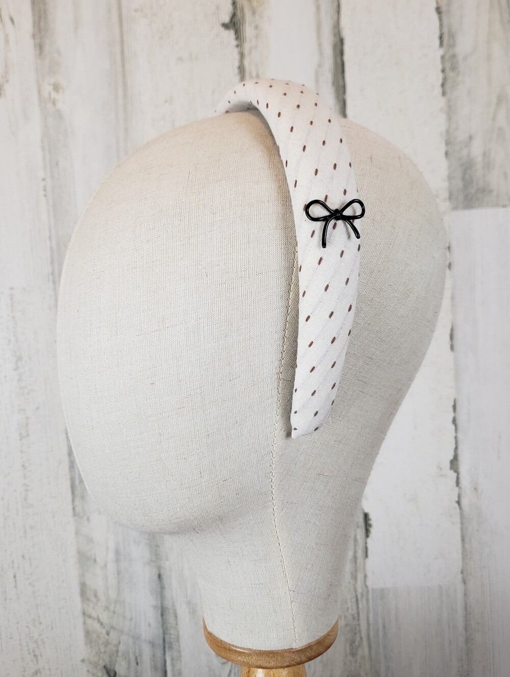 Ivory Padded Headband With Black Bow